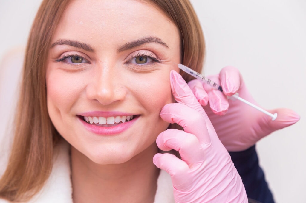 Close-up of patient receiving crows feet Botox treatment to soften smile lines around the eyes.